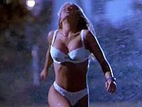 Carmen Electra stripped to her hot white bra and panties and get all wet in the sprinkler in this celeb video.
